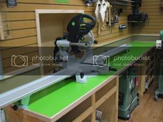 a table saw is sitting on top of a work bench