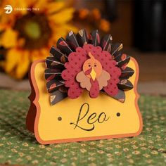 a close up of a card with a turkey on it's head and the word leo written in black