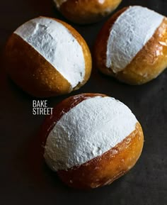 four round breads with white and red stripes on them