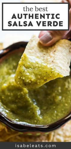 a tortilla chip being dipped with salsa sauce in a black bowl and text overlay that reads, the best authentic salsa verde