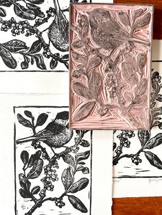 four different types of paper with flowers and birds on them, one is made out of copper foil