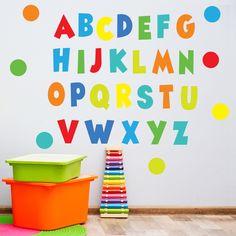 the colorful alphabet wall decals are on display in this child's playroom