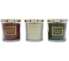 three candles in different colors and sizes