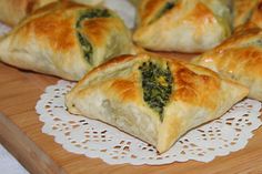 several small pastries on a wooden cutting board