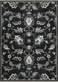 a black and white rug with floral designs on the bottom, in front of a gray background