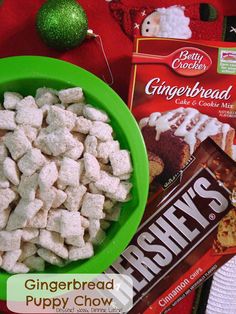 a green bowl filled with marshmallows next to a bag of gingerbread puppy chow