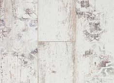 an old white wood floor with peeling paint on the wall and wooden planks in the background