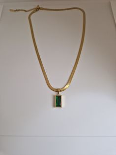 Gold snake chain necklace with beautiful green pendant Stainless steel and tarnish free Snake Chain Necklace Gold With Pendant, Snake Necklace Gold, Modern Green Metal Necklaces, Modern Green Rectangular Pendant Jewelry, Green Minimalist Tarnish-resistant Necklace, Modern Green Pendant Jewelry, Elegant Green Stainless Steel Necklace, Green Tarnish-resistant Pendant Necklace, Green Pendant Chain Necklace As Gift