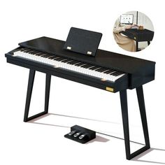 a black piano with a laptop on it's stand next to an ipod dock