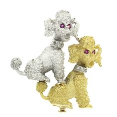 This outstanding vintage pin/brooch is crafted in solid 18k white and yellow gold and features two extremely detailed and textured poodle dogs. The adorable poodles are neatly set with fine rubies at their eyes, as well as gorgeous diamonds that line their collars. These lovely stones show remarkable brilliance and eye-catching sparkle for an absolutely attractive look on this piece. A truly special piece of art that speaks for its remarkable workmanship and quality. Enjoy! -- Item Details -- Ma Poodle Jewelry, Poodle Dogs, Vintage Poodle, Dog Jewelry, Jewelry Picture, Orange Sapphire, Dog Pin, Poodle Dog, Red Ruby