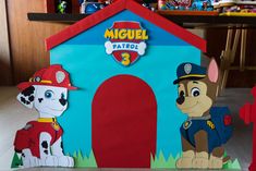 there is a cardboard house made to look like a fireman and his doghouse