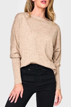 This sweater knit top is the epitome of relaxed style. With its eased fit and slouchy/off-shoulder design, it exudes effortless charm. The long sleeves feature high cuffs, adding a touch of sophistication. Made from super soft fabric, it offers both comfort and a luxurious feel. 50% Rayon | 28% Polyester | 22% Nylon Hand Wash Cold, Dry Flat Length 25 1/2" (size small) Drape Wide Neck Long Dolman Sleeve Eased Fit Easy 30-Day Returns & Exchanges Sabrina is 5'7 and wearing XS in Black & Martini Oli Wide Neck Top, Taylor Jackson, Business Casual Top, Womens Knit Tops, Open Neck, Maxi Dress Navy, Maxi Dress Evening, Summer Party Dress, Shoulder Design