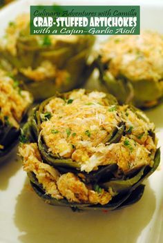 crab stuffed artichokes on a white plate