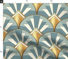 a blue and gold wallpaper with an art deco style design on it's side