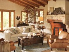 a living room filled with furniture and a fire place