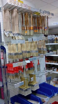 the shelves are filled with different kinds of utensils