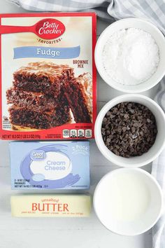 ingredients to make chocolate fudge cake laid out on a table