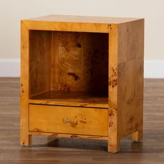 a small wooden cabinet with two drawers on one side and an open drawer on the other