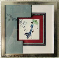 a framed painting with a woman holding an umbrella