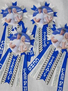 four blue and white ribbons with pictures of people on them are arranged in the shape of starbursts