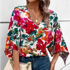 Red Printed V-neck Shirt, Chic Multicolor V-neck Shirt, Chic Printed V-neck Shirt, V-neck Floral Print Fall Shirt, Chic Red Blouse With Relaxed Fit, Fall Floral Print V-neck Shirt, V-neck Floral Print Relaxed Fit Shirt, Multicolor V-neck Shirt, V-neck Printed Tops For Brunch