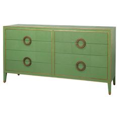 a green and gold dresser with three drawers