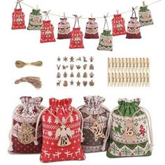 several bags and decorations are hanging on a line with clothes pins, tags, and other items