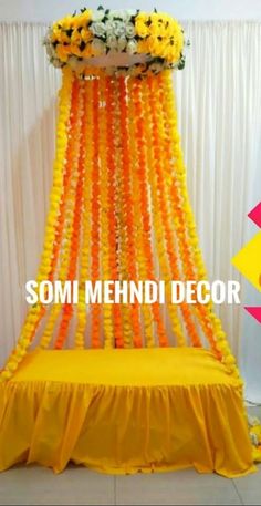 an orange and yellow wedding decoration with flowers