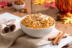 a white bowl filled with oatmeal sitting on top of a table