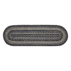 a black and white braided rug is shown on a white background, it looks like an oval