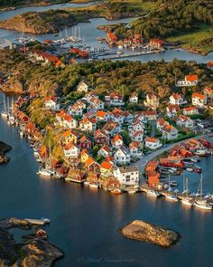 an aerial view of a harbor with boats and houses