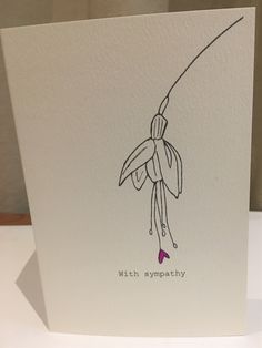 a white card with a drawing of a woman holding a fishing rod on it's back