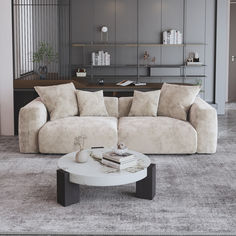 a living room filled with furniture and a white coffee table