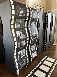 a display case with black and white pictures on the sides, along with a rug in front of it