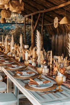 a long table with plates and place settings