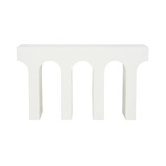 a small white table with three arches on it's sides and one section missing from the top