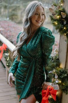 Emerald Up To Something Dress You could definitely be up to somethin' in this dress! Hit all of the holiday parties and any night out will be memorable in this stretchy and fully-lined stunner. The glittering green fabric is sparkle from top to bottom, but it is also covered with tiny gold tone sequins that give it an overall gold sheen. The set elastic waistband and ruching on the skirt hug the body. The plunging neckline is perfect for displaying the newest jewelry. The zippered back keeps the Boutique Trends, Engagement Dresses, Green Fabric, Plunging Neckline, Green Dress, Holiday Parties, Elastic Waistband, The Holiday, Emerald