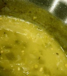 a pot filled with soup sitting on top of a stove