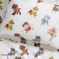 this is a bed sheet with cartoon dogs on it