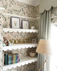 there is a shelf with books on it and a lamp next to the bookcase