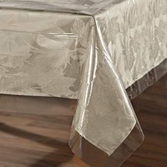 a white table cloth on top of a wooden floor