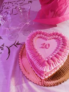 a heart shaped cake sitting on top of a table