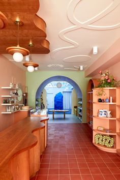 the inside of a store with shelves and vases