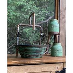 a green sink sitting on top of a window sill