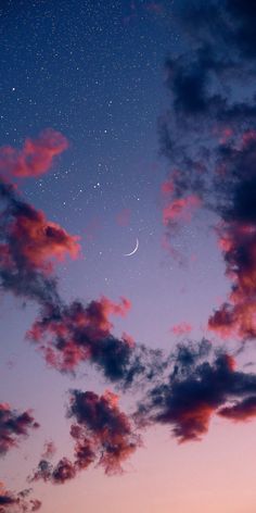 the sky is filled with clouds and stars