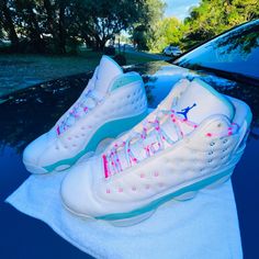 The Air Jordan 13 Gs "Aurora Green" Is A Kids' Edition Of Michael Jordan's Thirteenth Signature Shoe With A Fresh Design For The Summer Months. Lauded For Its Comfort Both On And Off The Court, The Jordan 13 Was Worn By "His Airness" During His Final Season With The Chicago Bulls In 1997-98. This Colorful Take Features A Bright Aurora Green Felt Base With White Leather Paneling And Pink, Green, And Blue Stitching Accents. They Are In Mint Condition. Worn Once. Basically Brand New, No Box. Size I Pink Synthetic Basketball Shoes With Abzorb Midsole, Pink Basketball Shoes With Round Toe, Jordan Shoes For Light Sports With Round Toe, Jordan Shoes With Laces For Light Sports Round Toe, Pink Mid-top Jordan Shoes For Sports, Pink Mid-top Jordan Shoes With Boost Midsole, Pink Jordan Shoes With Cushioned Footbed, White Lace-up Jordan Shoes With Air Cushioning, Pink Jordan Shoes With Round Toe For Sports