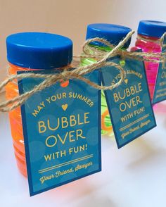 three bottles of bubble over with fun on the label hanging from twine string and tags attached to each bottle