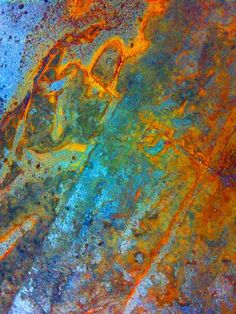 an abstract painting with orange, blue and green colors on it's surface is shown