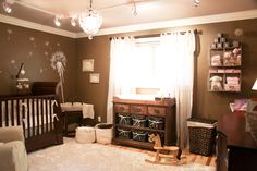 a baby's room decorated in brown and white