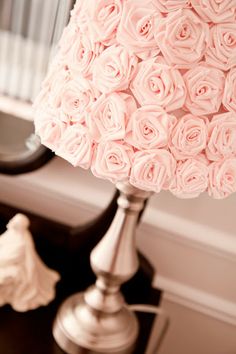 a lamp that has pink roses on it